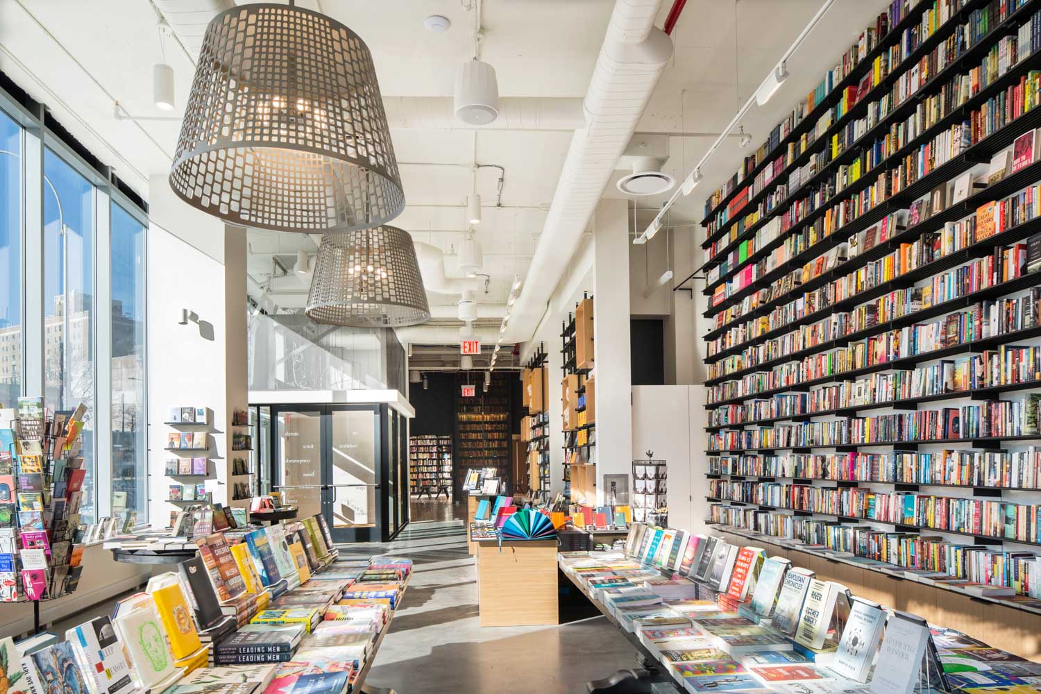 A wall of books and table of books at The Center for Fiction, one of the indie bookstores in NYC.