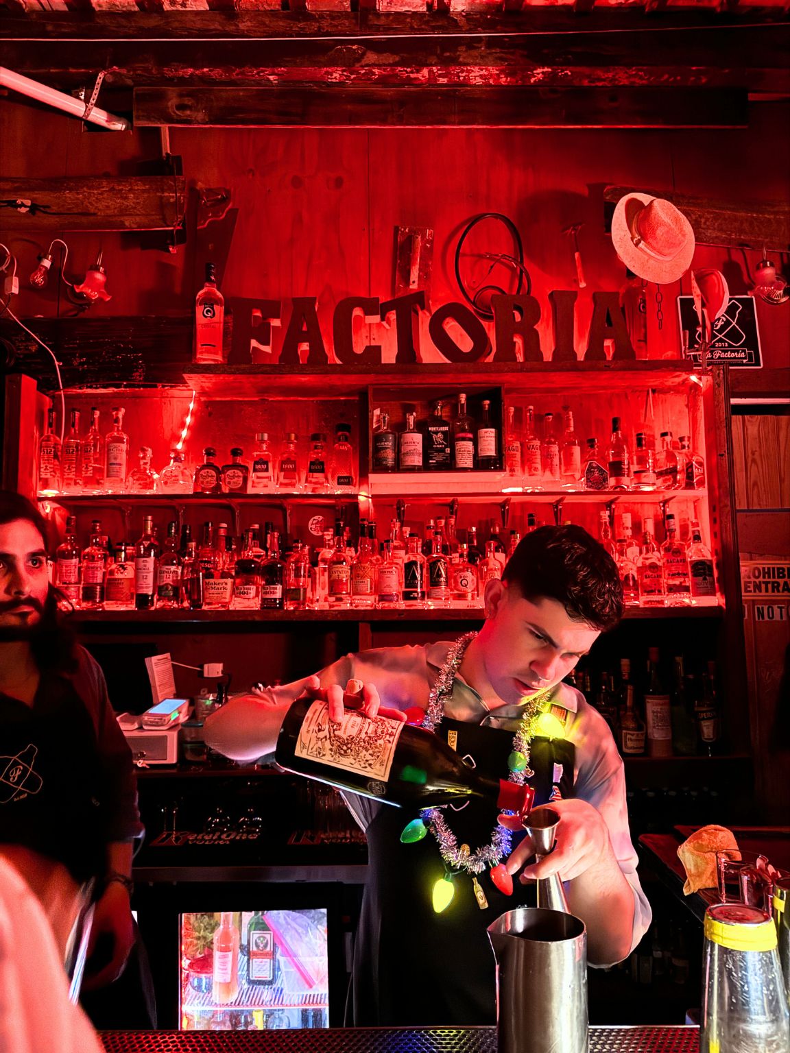 A man making drinks at a bar in Puerto Rico.