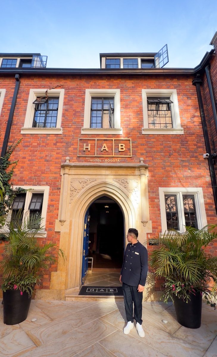 The front of a hotel with brick walls.