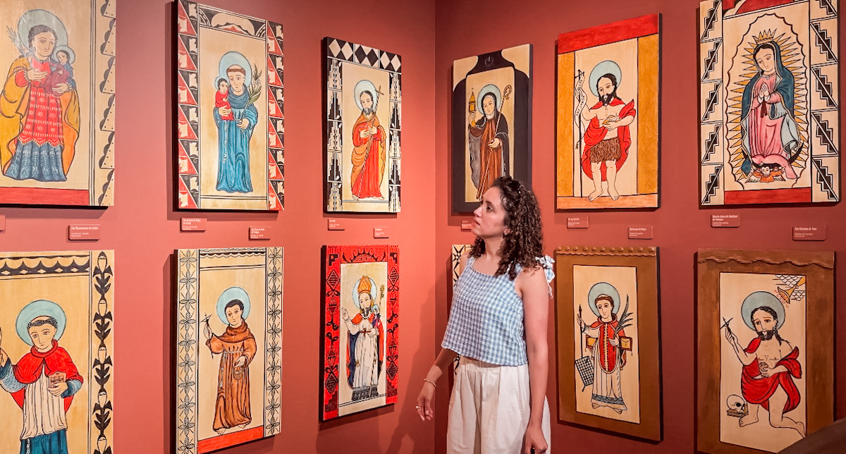 A woman looking at religious art at Indian Pueblo Cultural Center in Albuquerque, New Mexico.